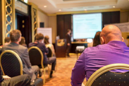 The audience listens to the acting in a conference hallの写真素材