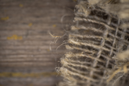 Gunny sack texture and wood plank table backgroundの写真素材