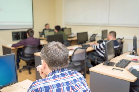 Students working in computer class at the collegeの写真素材