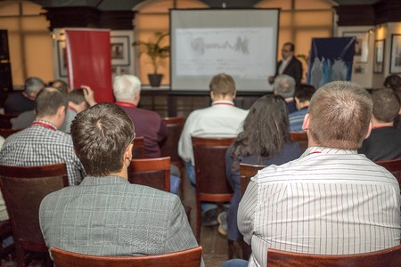 The audience listens to the acting in a conference hallの写真素材