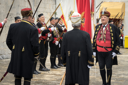 Perast, Montenegro - May 15, 2016: Shooting the Kokot (rooster) celebration. Celebrates the liberation of Perast from Turkish in 1654. Supreme Commander takes military parade.のeditorial素材