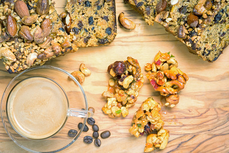 Cup of coffee with cookies and coffee beans, lying on the wooden table, top viewの写真素材