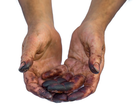 Man show his dirty hands isolated on white.の写真素材