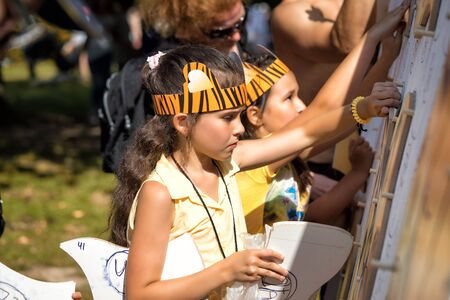 Moscow, Russia - July 31, 2016: Children collect large puzzle in the open air during the celebration of the international tiger day in Moscow.のeditorial素材