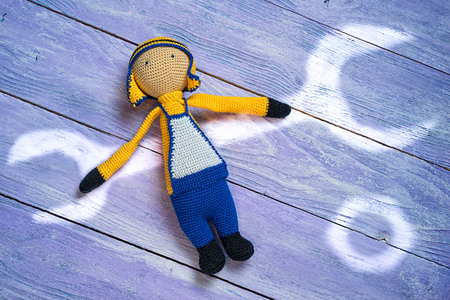 amigurumi crocheted worker with a painted light wrench and nut, repair conceptの写真素材