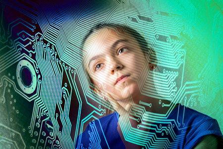girl thoughtfully looking throw the motherboard silhouette, concept of informatics computer science...