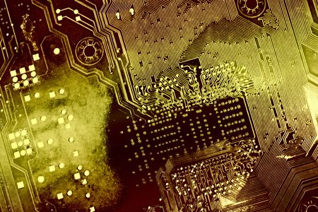 printed circuit board, toned into gold colors. background as a symbol of the golden age of...