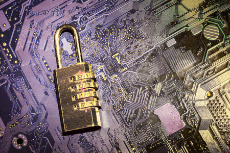 padlock on a computer circuit board, concept of information securityの写真素材