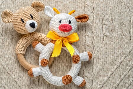 Concept of learning the trade in the financial markets. Exchange Trade Academy. Knitted homemade rattles bull and bear on the knitted background with copy space.の写真素材