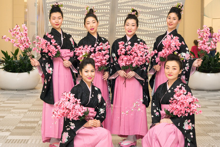 Moscow, Russia - March 24, 2017: group of Japanese geisha girls in traditional kimono in Riviera shopping center at the opening of a new store UNIQLO Unique Clothing Warehouse.のeditorial素材