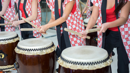 Moscow, Russia - March 25, 2017: group of Japanese Taiko drummers girls perform in Kaleidoscope shopping center on the at the opening of a new store UNIQLO Unique Clothing Warehouse.のeditorial素材