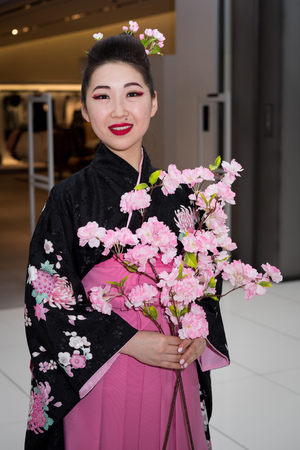 Moscow, Russia - April 02, 2017: geisha in traditional japanese kimono in the shopping center Otrada corridor during the Maintain a sushi record event.のeditorial素材