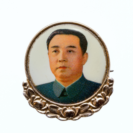 North Korea, April 20, 2017: Vintage North Korean badge with a portrait of the President of the Democratic People's Republic of Korea DPRK Kim Il-sung (1912 - 1994) isolated on white backgroundのeditorial素材