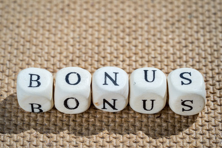 bonus word made from toy cubes with lettersの写真素材