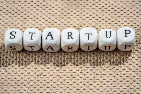 startup word made from toy cubes with lettersの写真素材