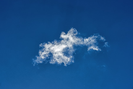White clouds in a blue sky in a daytimeの写真素材