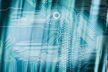 oval frame of sharp diagonal shadows on the motherboard with a copy space in the middle on a lighter...