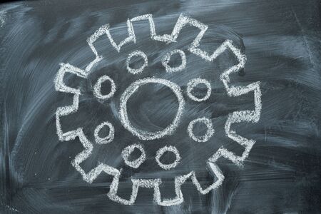 The blackboard drawing gear with chalk and the concept of industrial education.の写真素材
