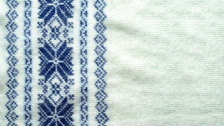 Knitted seamless Christmas pattern with snowflakes and copy space for your text
