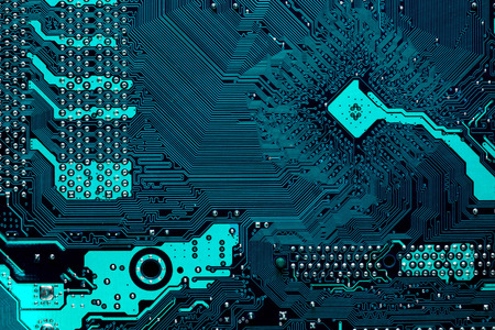Blue circuit board background of computer motherboard. Pattern in form of arrow or pointer.の写真素材