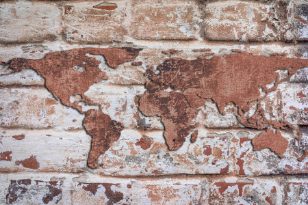 world map from a cracked stone wall on the red bricks wall background grunge styleの写真素材