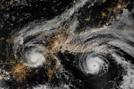 Hurricane over northeastern United States at night. New York City and Newark, New Jersey. Long Island. Aerial view. Elements of this image furnished by NASA.の写真素材