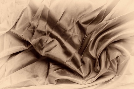 Smooth elegant silk or satin luxury cloth texture. Retro style, sepia color.の写真素材