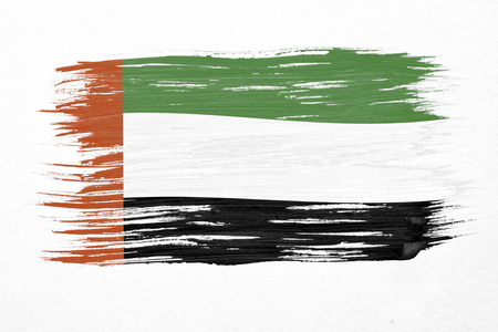 Art brush watercolor painting of UAE flag blown in the wind isolated on white background.の写真素材
