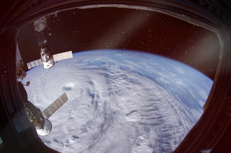 Hurricane is seen from spaceship porthole.の写真素材