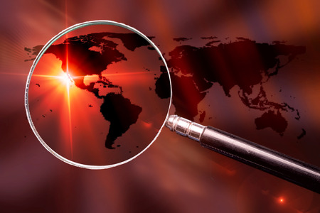 World map with magnifying glass - conceptual global search image.