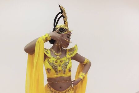 Beautiful asian woman doing pa with hands, with long false nails, close up portraitの写真素材