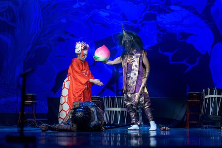 Traditional Japanese performance. Actors in traditional costumes perform on a stage. Dead samurai...