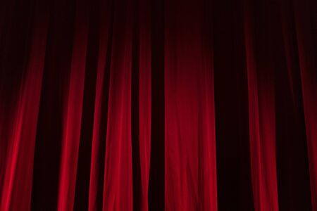 Theater red curtain with spot lightingの写真素材
