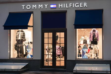 Moscow, Russia - December 15, 2019: Tommy hilfiger entrance and storefront at night.