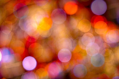 Multi color mostly yellow, red and orange bokeh circle shape blur abstract.
