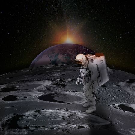 Astronaut on moon surface with spaceの写真素材