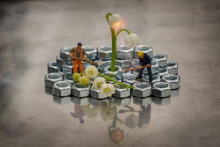 Miniature people city utility services landscape the city territory and establish a street light...