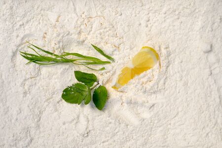 Top view of mojito ingredients on a white sugar powderの写真素材