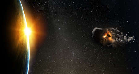 Asteroid flies near the earth orbit. Meteorite approaching Earth.の写真素材
