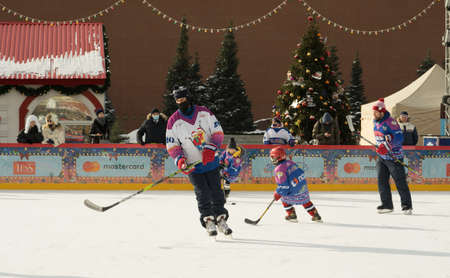 Moscow, Russia - February 20, 2022: World ice hockey champion Alexei Yashin conducts master classes at the GUM-Skating rink at the Red Square for everyone. Free public event.のeditorial素材