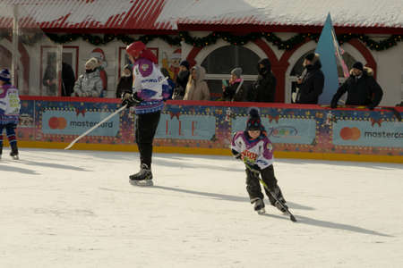 Moscow, Russia - February 20, 2022: World ice hockey champion Alexei Yashin conducts master classes at the GUM-Skating rink at the Red Square for everyone. Free public event.のeditorial素材