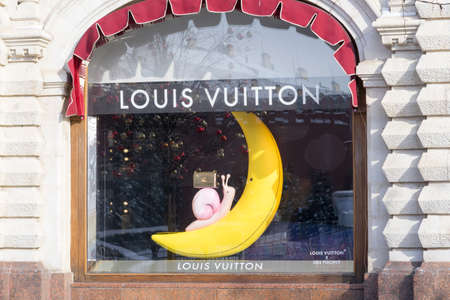Moscow, Russia - February 20, 2022: Louis Vuitton store at Moscow. Design with bag on snail in banana or moon.のeditorial素材
