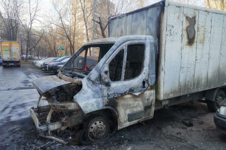 Moscow, Russia - April 14, 2021: burnt-out car in a parking lot on a Moscow street.のeditorial素材
