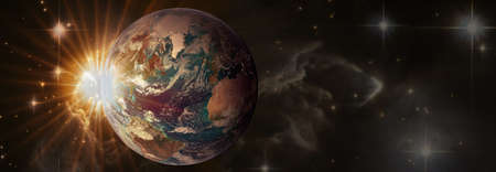 Sunrise with lens flare. Beautiful planet Earth in space in sun rays with copy space, panoramic view.の写真素材