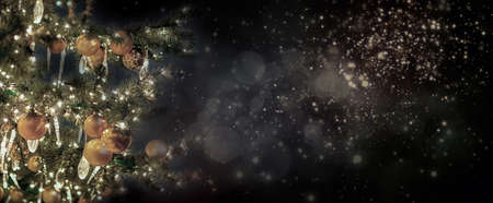 Christmas tree and blur abstract lights backfround with copy space. New year conceptual postcard.の写真素材