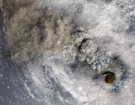 Volcano eruption with smoke and hurricane clouds, satellite view. Collageの写真素材