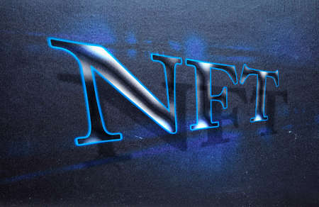 Neon sign "NFT" for non fungible token in perspective with shadowsの写真素材