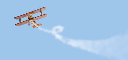 Toy plane is flying in the sky with track and copy space. Vacation and travel concept.の写真素材