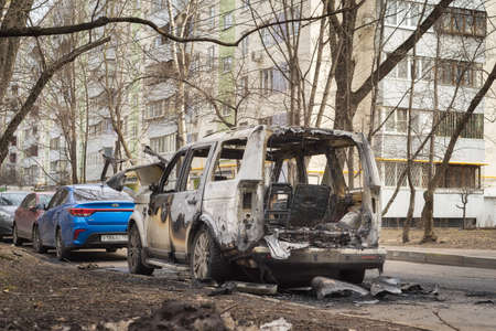 Moscow, Russia - April 15, 2022: burned out Land Rover car on the street. back view.のeditorial素材