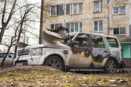 Moscow, Russia - April 15, 2022: burned out Land Rover car on the street. Based on the nature of the fire, hood torn from the inside and preserved tires, cause was an electrical short circuit.のeditorial素材
